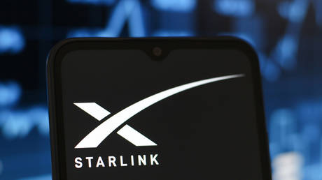 In this photo illustration, the Starlink logo is seen displayed on a smartphone screen.