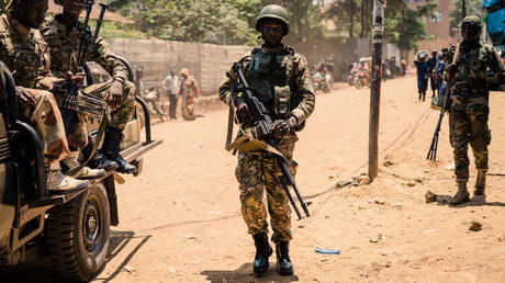 FILE PHOTO. M23 rebels guard a unit of surrendering Congolese police officers who will be recruited into the rebel group on February 22, 2025 in Bukavu, Democratic Republic of Congo.