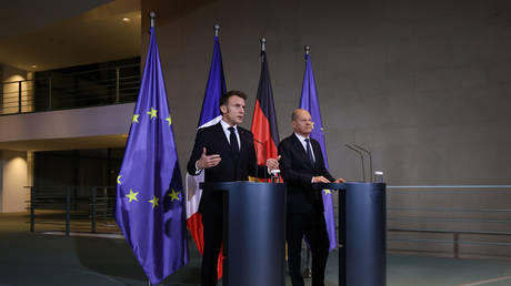 German Chancellor Olaf Scholz and French President Emmanuel Macron speak to the media following talks on March 18, 2025 in Berlin.